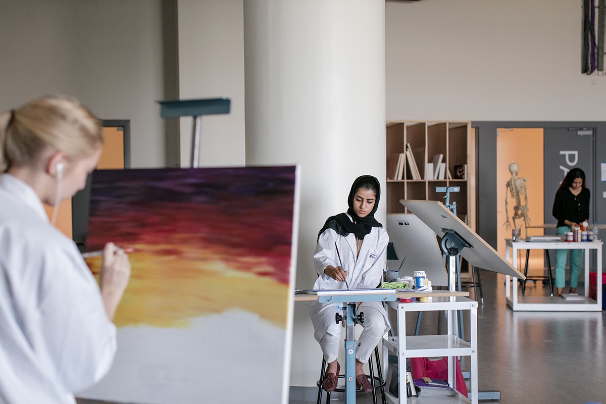 Students attend professor John Torreano's painting class at NYU Abu Dhabi.