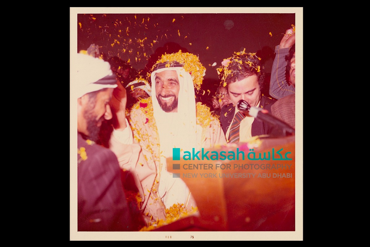 Sheikh Zayed and Zaki Nusseibeh covered in flower petals during a visit to India., February 1975.
