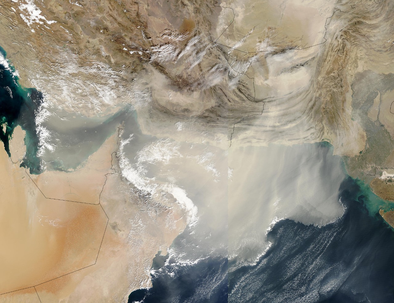 A massive dust storm blowing large quantities of dust out over the Gulf and Arabian Sea (December, 2003).