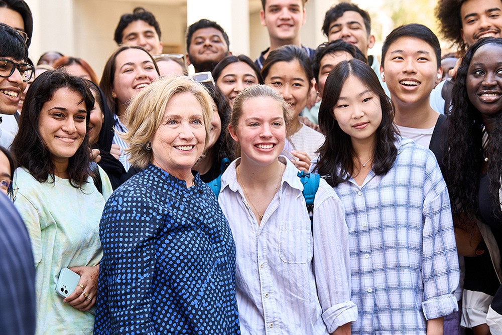 Former U.S. Secretary of State Hillary Rodham Clinton with NYUAD students while visiting the university, March 7, 2023.
