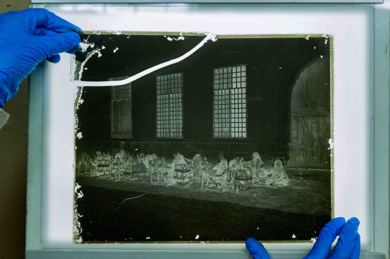 Preservation of a broken glass plate negative by al Mawrid archivist, Ibrahim Mohamed Ali