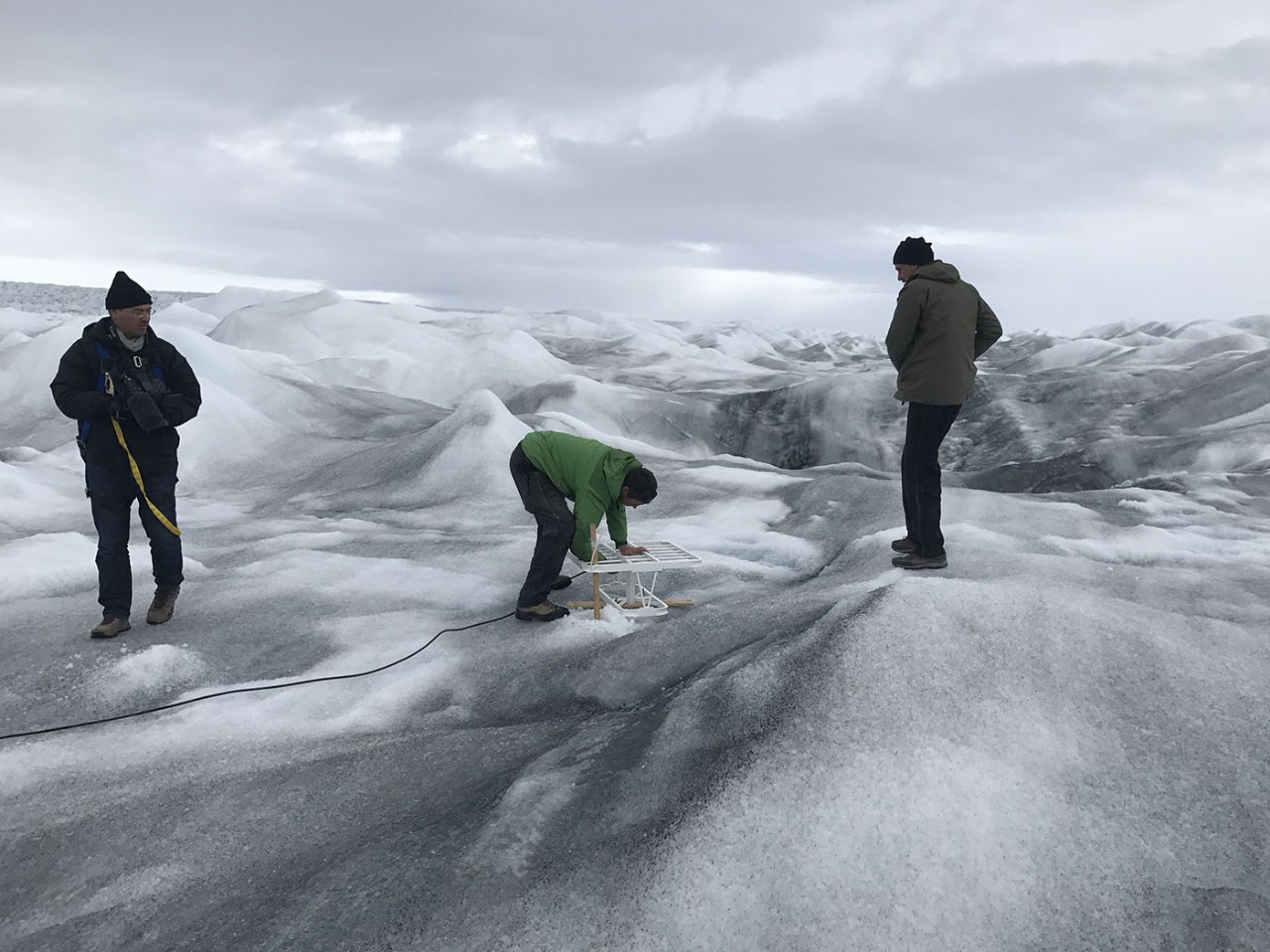 Researchers from the NYU Abu Dhabi Center for Global Sea Level change place sophisticated GPS equipment in the Greenland ice sheet to track how fast it's melting.