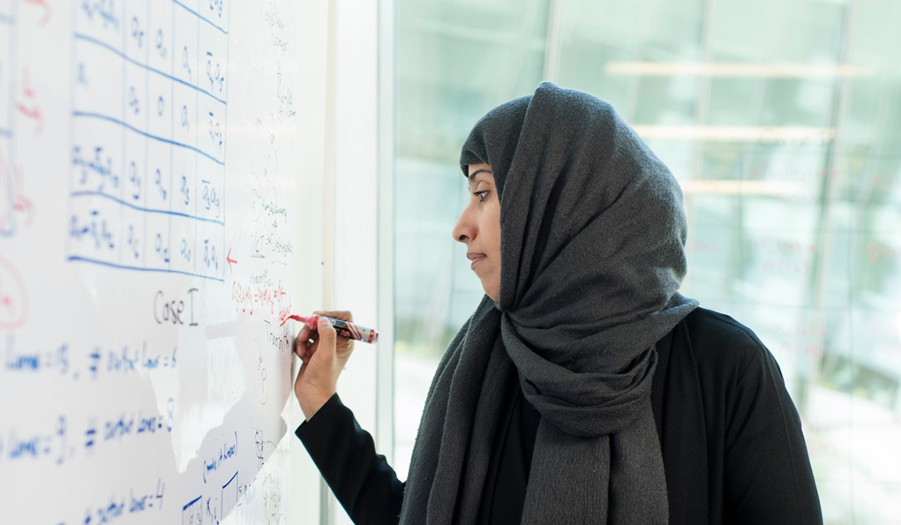 Cryptologist Hoda Al Khzaimi works on a problem in her office at NYU Abu Dhabi.