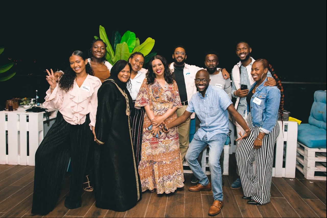 NYUAD staff pose for a celebratory photo.