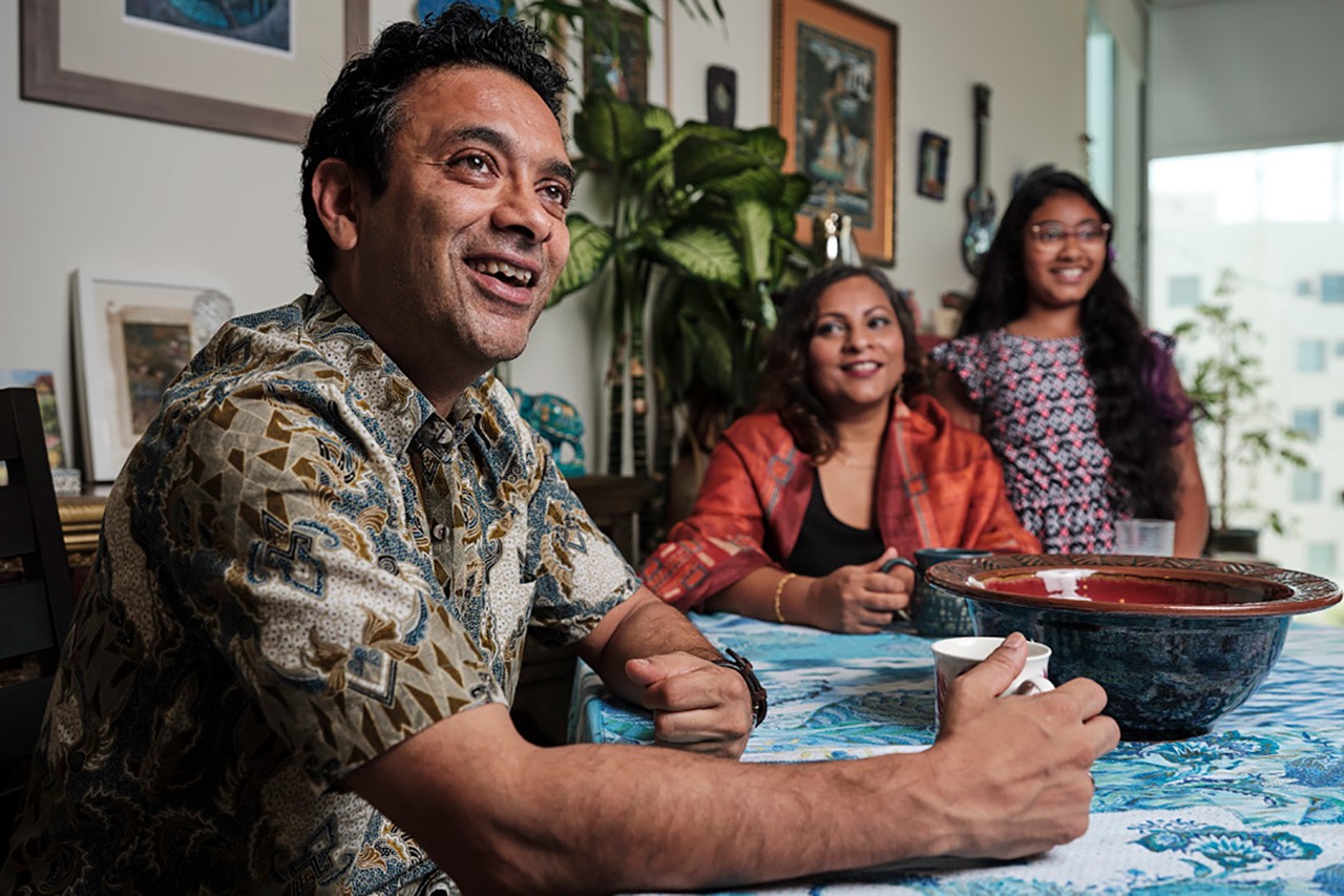 Assistant Professor of Biology Dipesh Chaudhury, left, and his family.