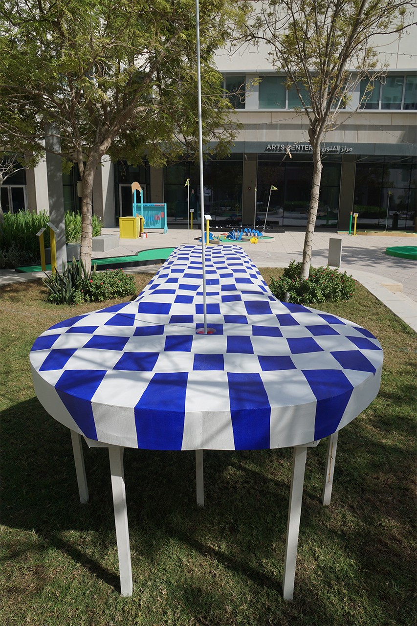 Title of Installation: DRIVE Material: Flexible plywood (Bendy Ply), hard-wood, MDF wood, paint (white, blue) Dimensions: 88 x 82 x 513 cm Exhibition: Putting for Pleasure and Politics: A Playable Sculpture Garden The East Plaza, The Arts Center NYU Abu Dhabi November 12 – 25, 2018