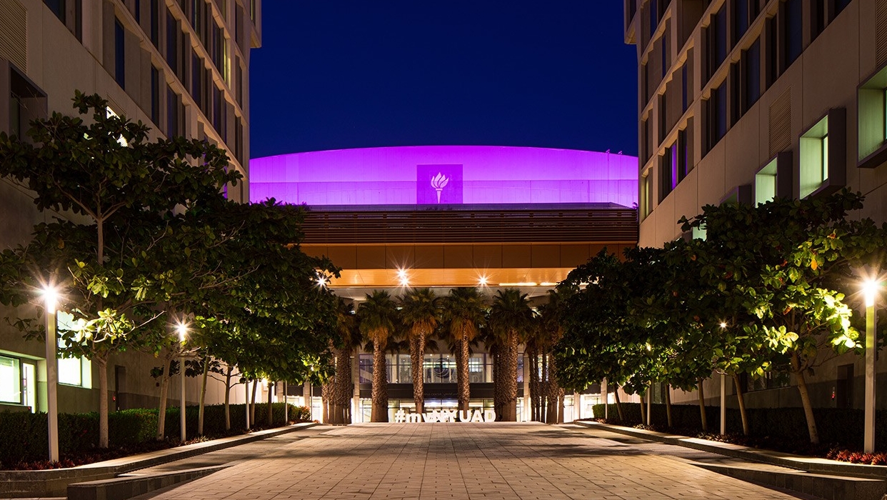 NYU Abu Dhabi campus center lights up purple for Commencement 2020.