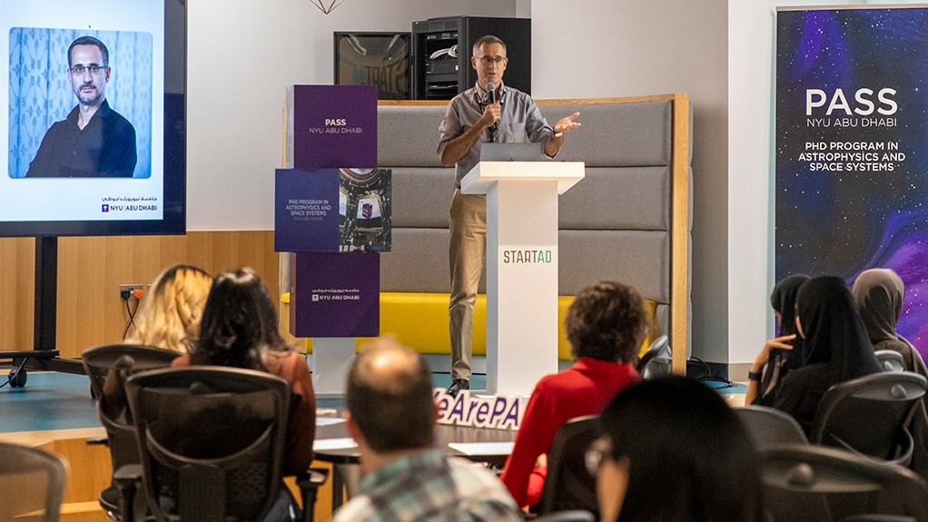 Andrea Valerio Macciò, head of NYU Abu Dhabi's PhD in Astro Physics and Space Systems, presents to a group of students.