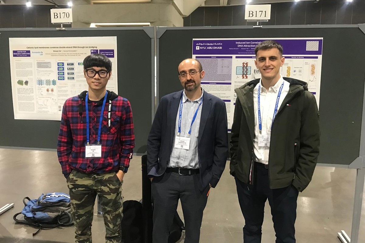 Dr He, Dr Kirmizialtin, and Marko Brnovic  standing in front of their research at the annual BPS conference.