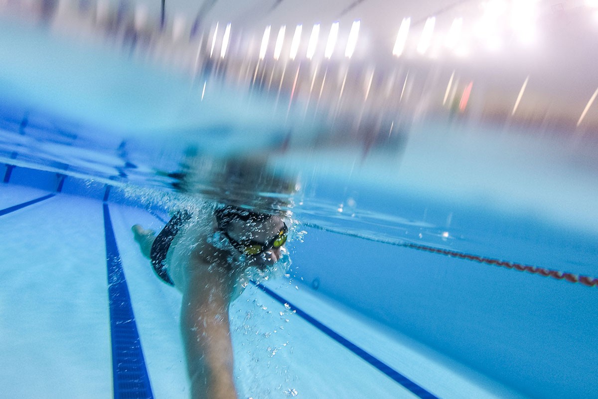 A swimmer in NYU Abu Dhabi's indoor swimming pool.