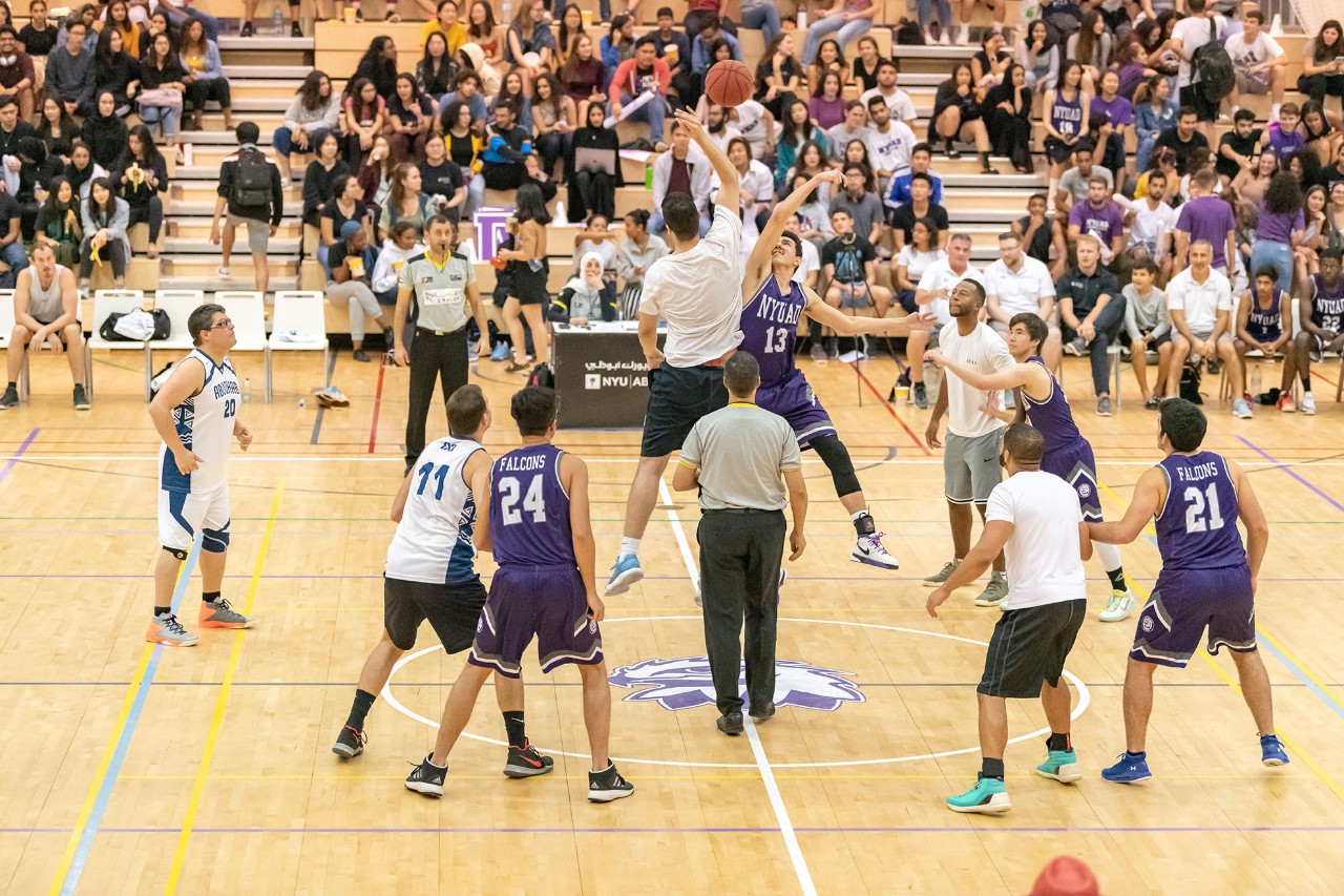 NYU Abu Dhabi men's basketball team in a game.