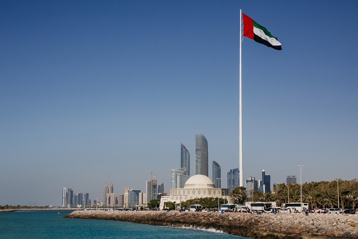 The view of Abu Dhabi along the corniche, with the UAE flag flying high. 