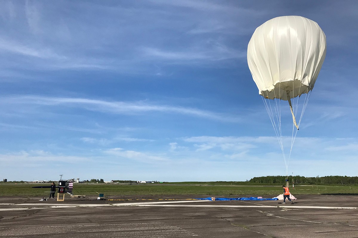 Matthew Jagdeo works on an implementation plan to use airships and aerostats (pictured) to provide medicines and other resources to Malawi and Zambia.