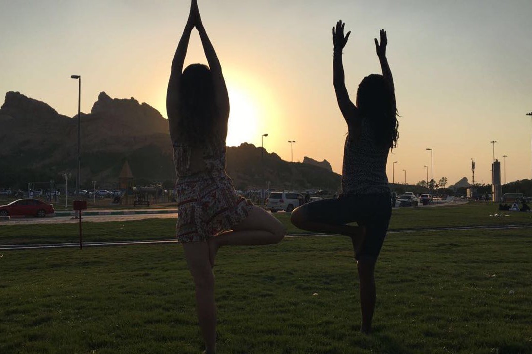 Vongai and Aygul, class of 2020, doing yoga