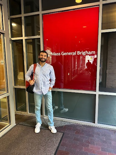 Mahmoud Elbeh, NYUAD Class of 2024 taking a photo outside Mass General Brigham, a not-for-profit health care system in the US. 