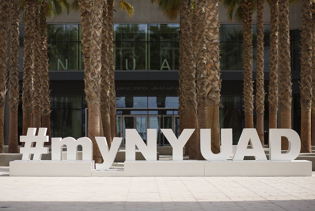 The #myNYUAD signage in front of the Campus Center.