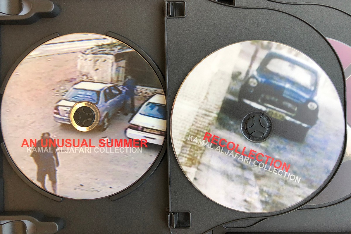 An image of two DVDs from the Kamal Al Jafari Collection: An Unusual Summer and Recollection.
