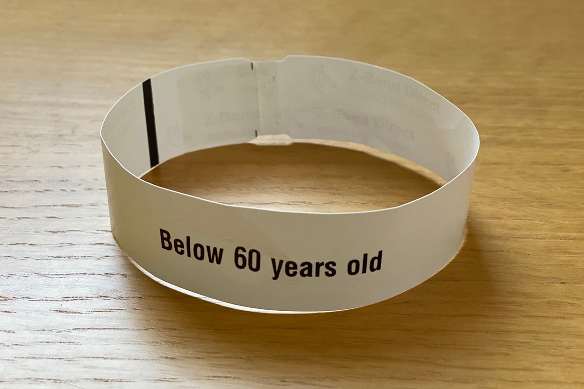 "Below 60 years old" bracelet. Paper and inkjet print. Yas Mall, May 2020. Pardoe-Westermann collection, promised gift to NYUAD COVID-19 Archive.