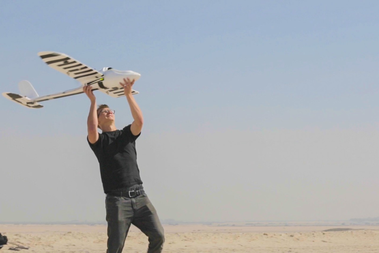 Martin Slosarik (Class of 2015) sends NYUAD's award-winning Wadi Drone into flight in a desert region near Abu Dhabi.