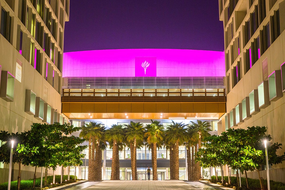 NYU Abu Dhabi's dome is lit up in pink in support of breast cancer awareness month.