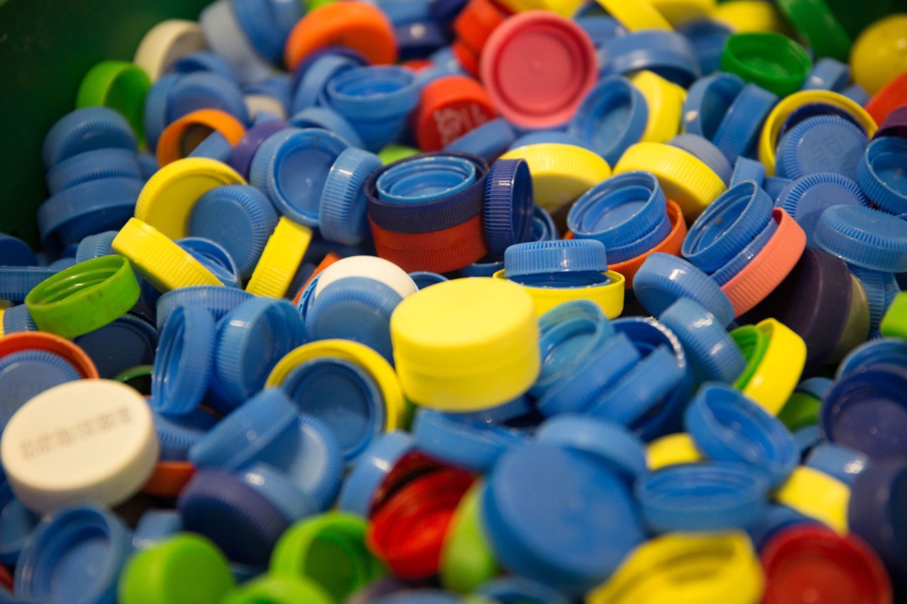 Colorful plastic bottle caps being recycled on NYU Abu Dhabi campus.