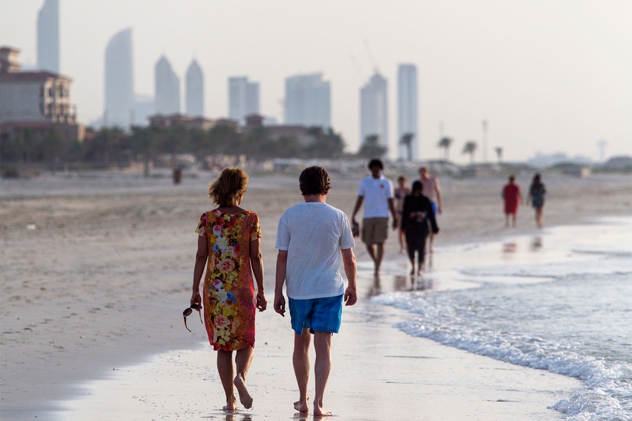 People strolling along Saadiyat beach in Abu Dhabi. 