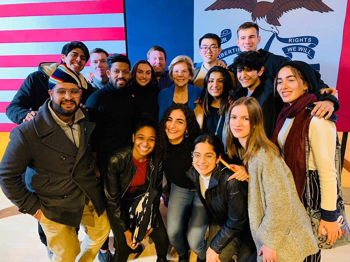 NYU Abu Dhabi students posed for a photo opportunity with United States presidential candidate Elizabeth Warren (center in blue) during their trip to the United States. 