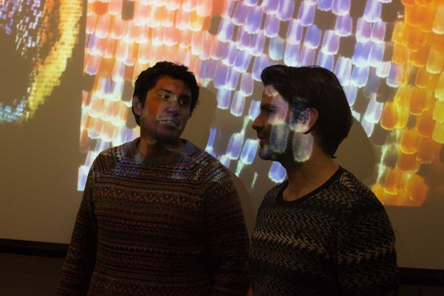 Actor Tenoch Huerta and Writer/Director Alexis Gambis test butterfly projections on screen. Photo credit: Renée Xie.