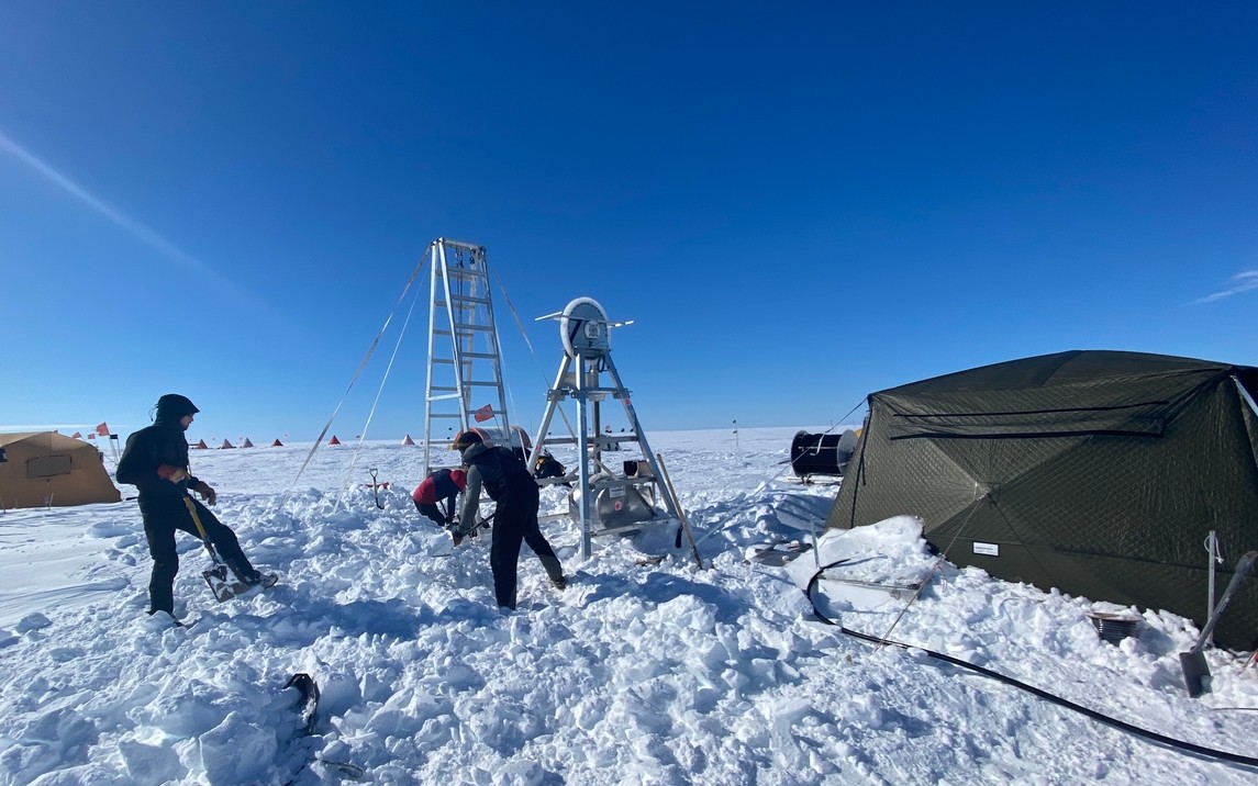 Researchers digging out the drill site after a three-day storm with winds reaching 50 knots. Drifts of snow accumulated up to five feet