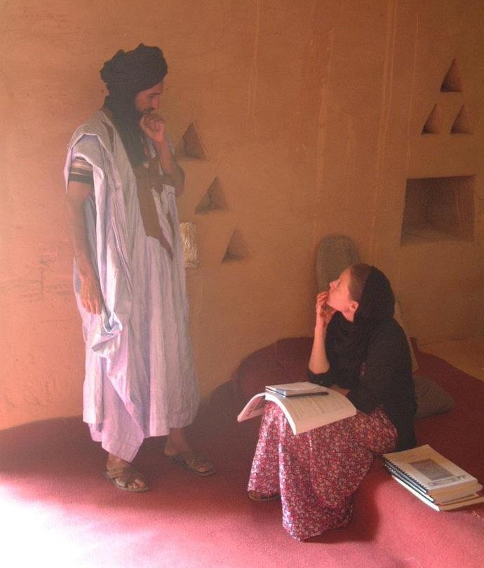Erin Pettigrew, NYUAD assistant professor of history, talks to a man in Mauritania for research into the country's political history.