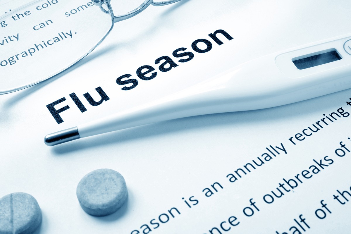 Flu season information, thermometer, and medication.