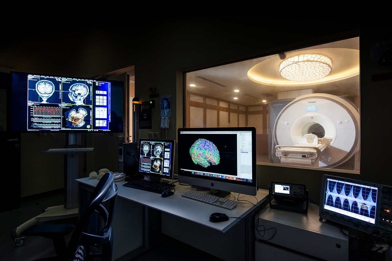 MRI results on computer screens in an MRI lab.