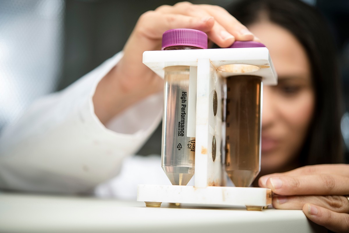 NYUAD researcher Farah Benyattou performs an experiment.