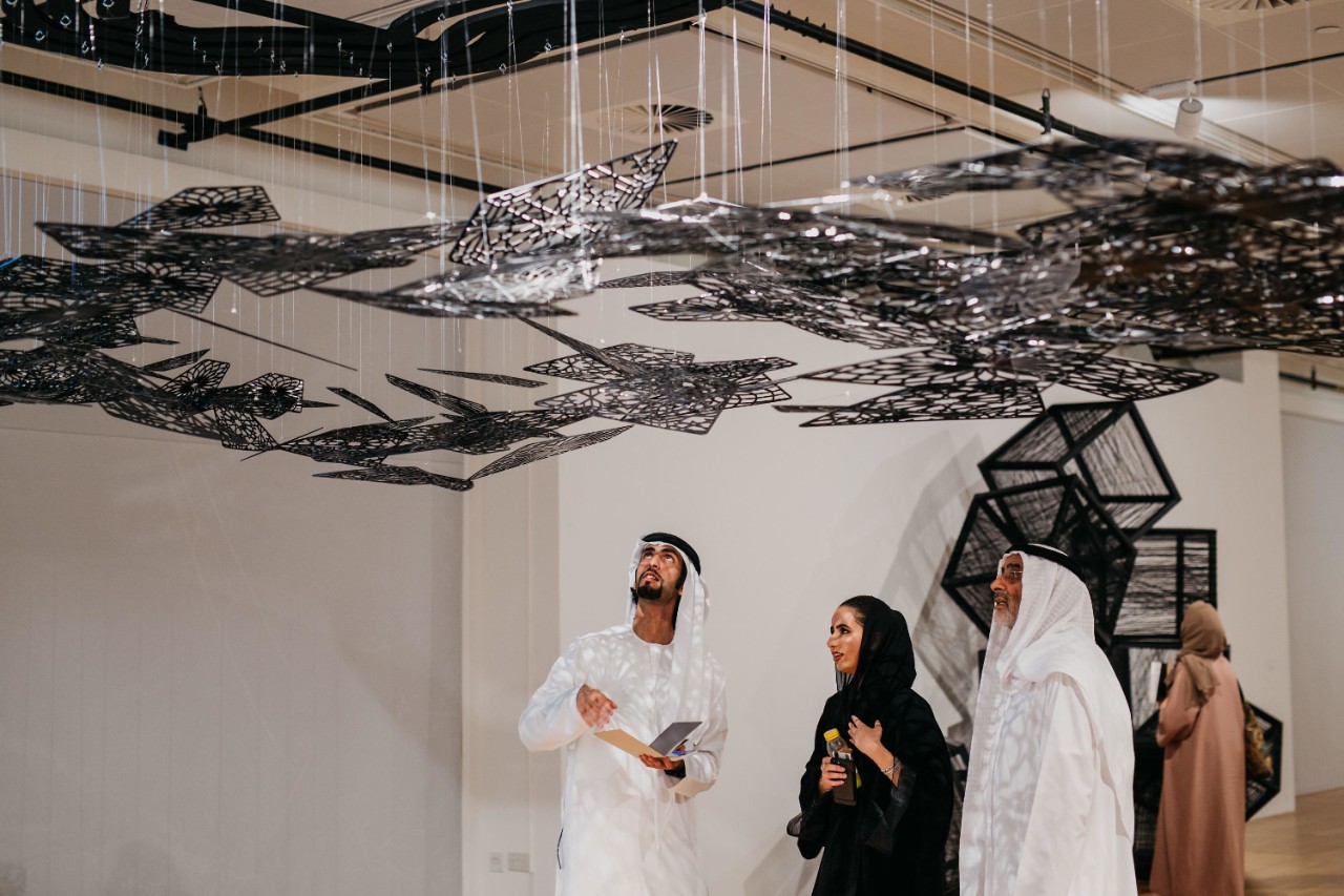 Visitors admire an art installation at the NYUAD Art Gallery.