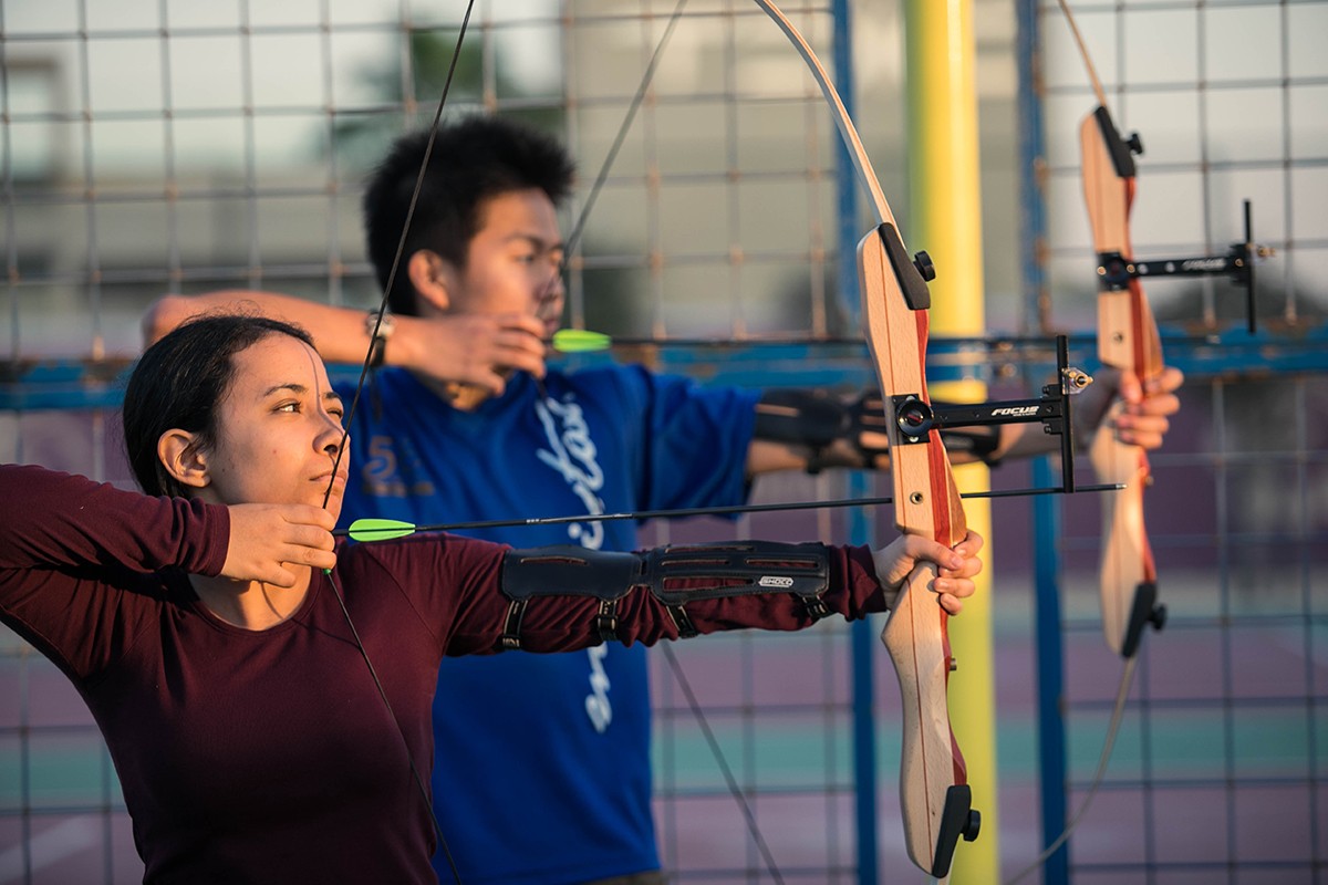 NYU Abu Dhabi students practice archery as part of the "Oh Shoot" archery Student Interest Group.